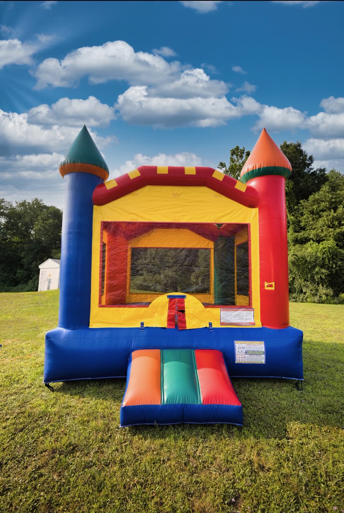 Classic Bounce House 2 inflatable rental set up on a lawn